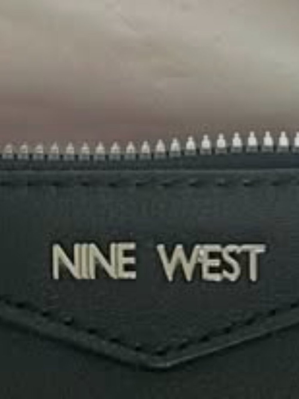 Nine West small black clutch w/short strap one zipper on inside pocket used once